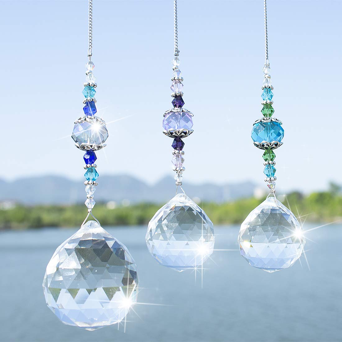 H&D HYALINE & DORA clear crystal ball 30mm prism catching sunlight and scattering rainbows