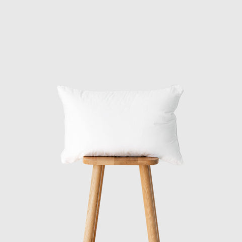 Hofdeco Premium lumbar pillow insert on outdoor chair delivering supportive comfort outdoors.