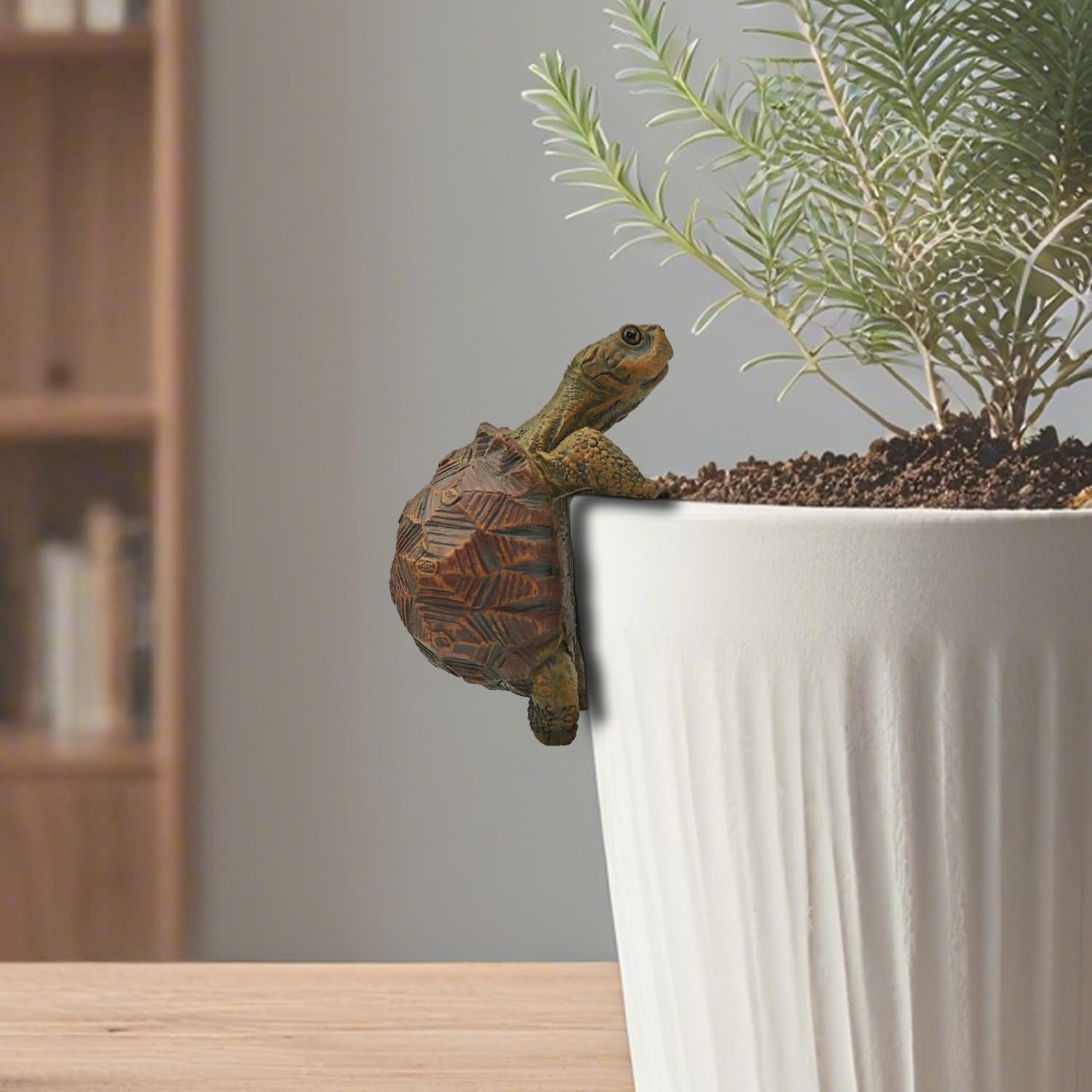 HoiiYoza turtle statue perched on a plant pot for natural charm.