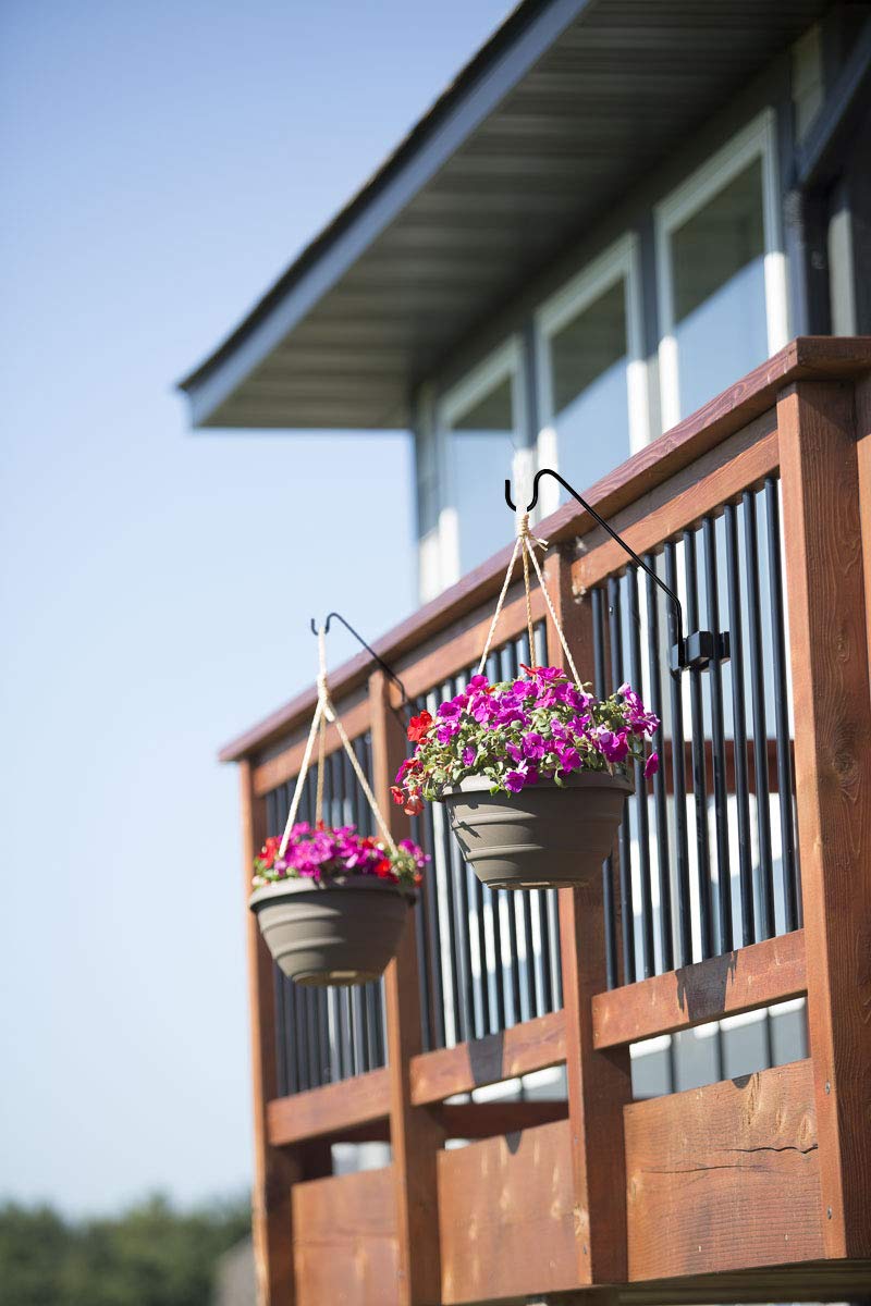 Hold It Mate flower basket hanger displaying blooms on railing