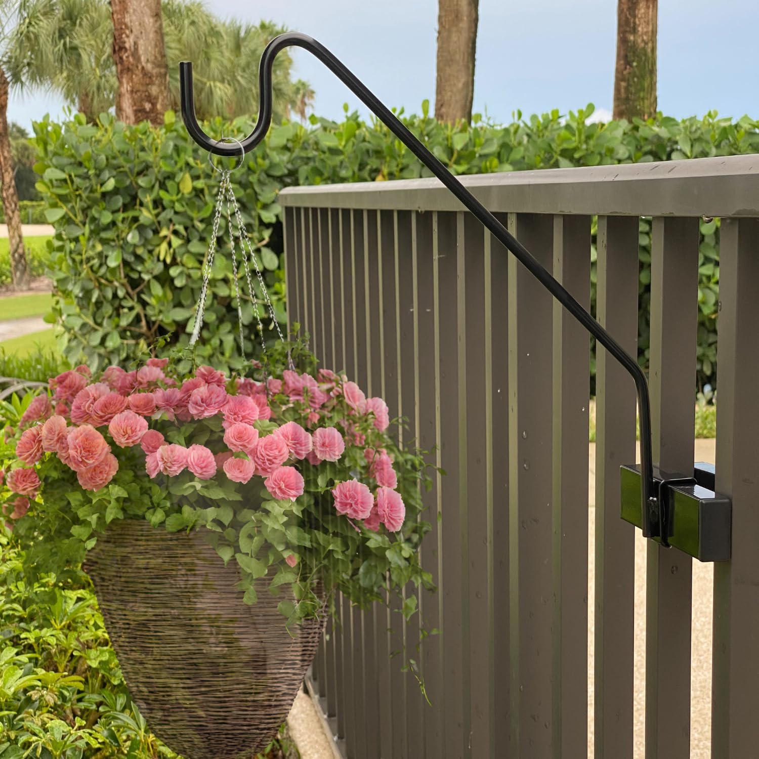 Hold It Mate vertical spindle hook kit on railing for sturdy plant display.