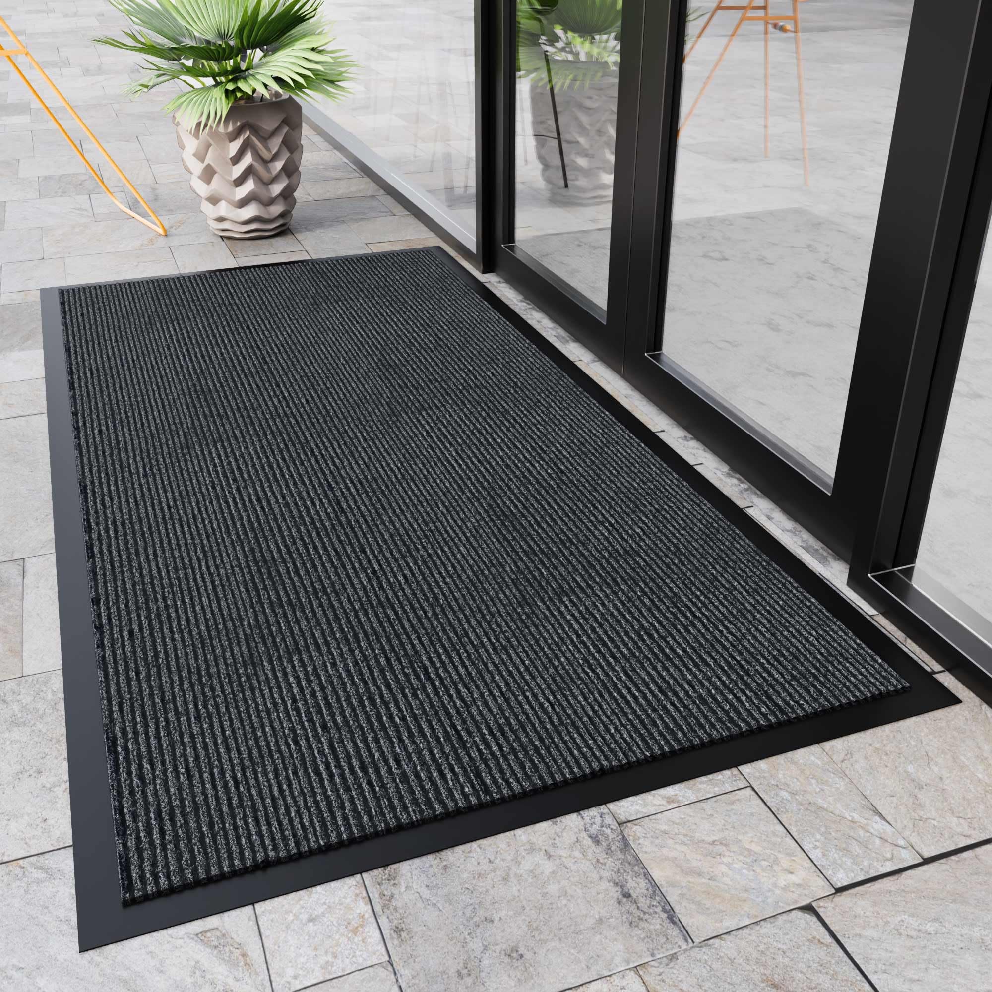 HOMEK door mat with non-slip backing stays secure at the doorway.