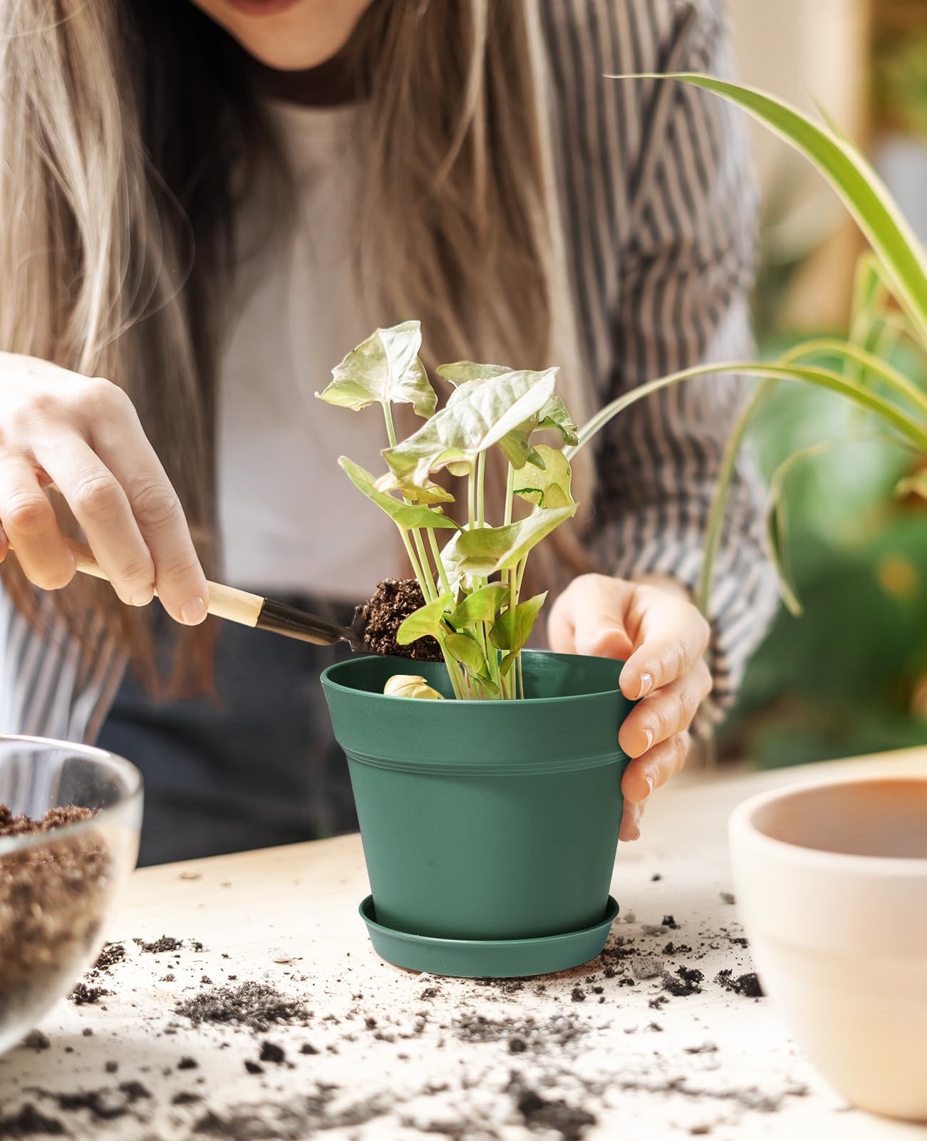Homenote pot tray removable for easy water collection and floor protection.