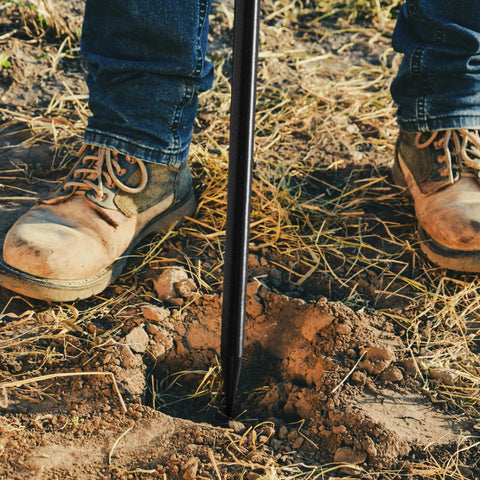 Homestead soil probe rod in use for detecting underground utilities safely.