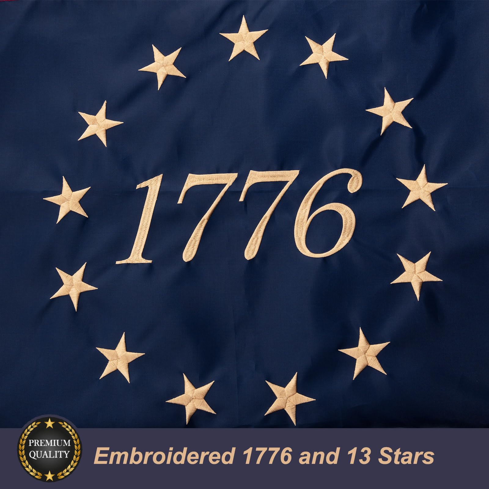 Close-up of embroidery showing the 13-star circle and 1776 inscription on the flag