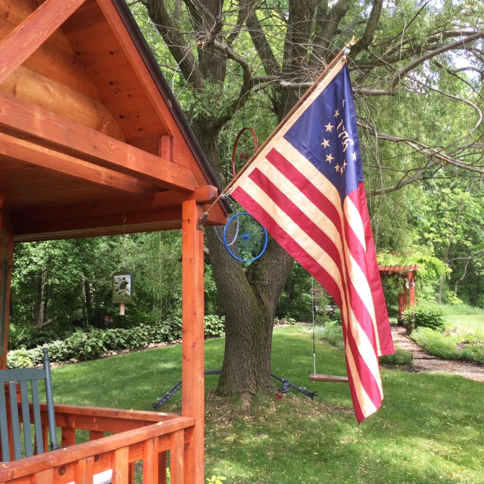 Vintage-style Homissor flag displayed on an exterior wall or porch