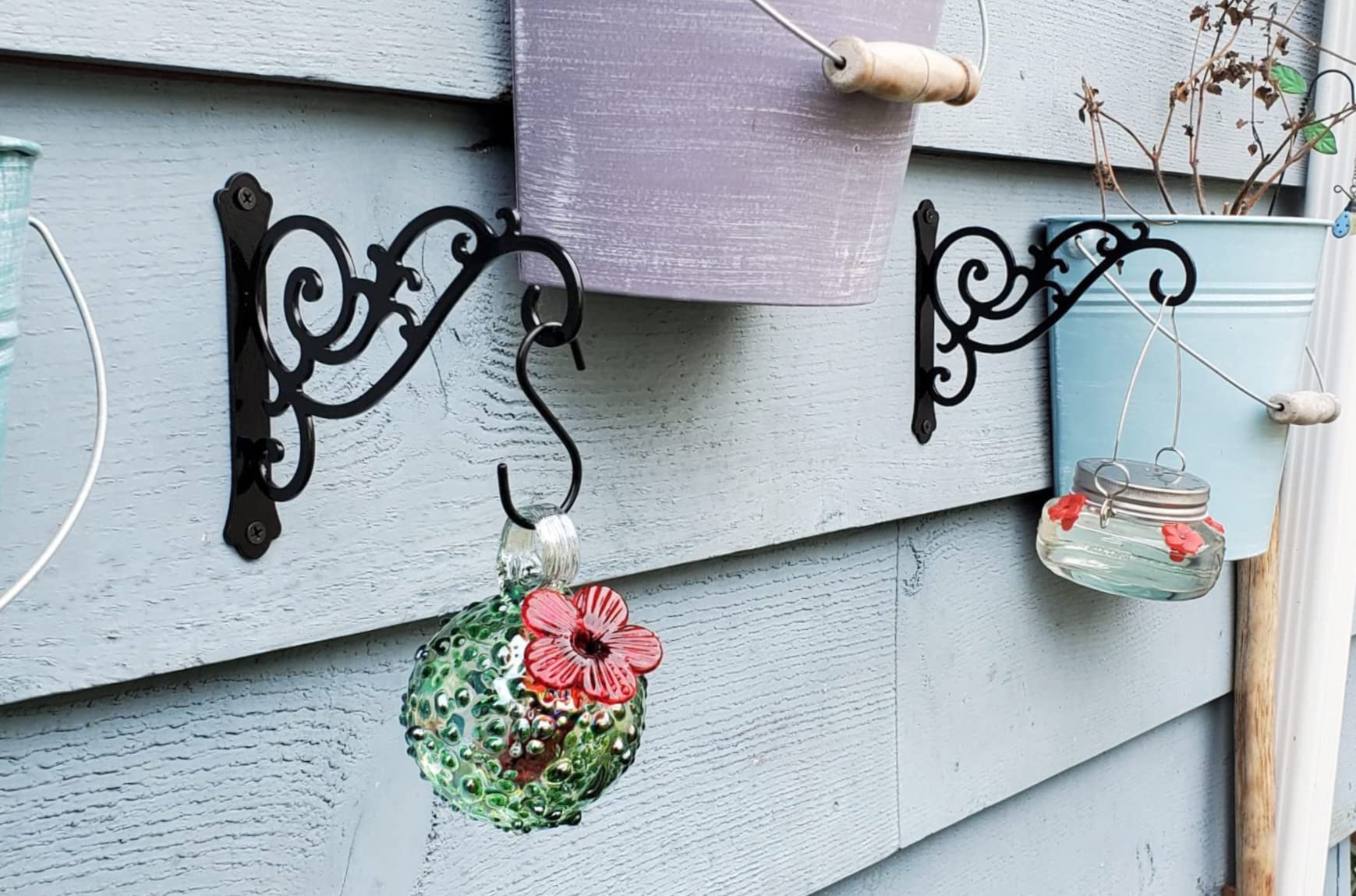 HongKim solid iron wall hook with black finish for durable outdoor decor.