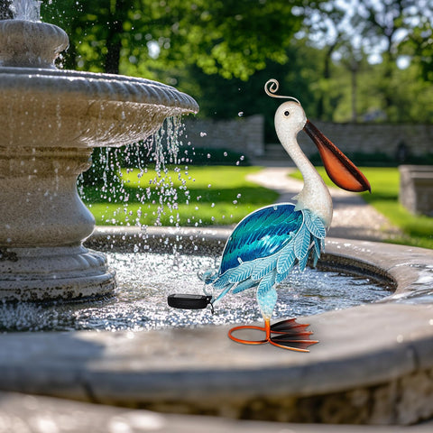 HONGLAND pelican statue at night illuminated by solar light for ambient mood.