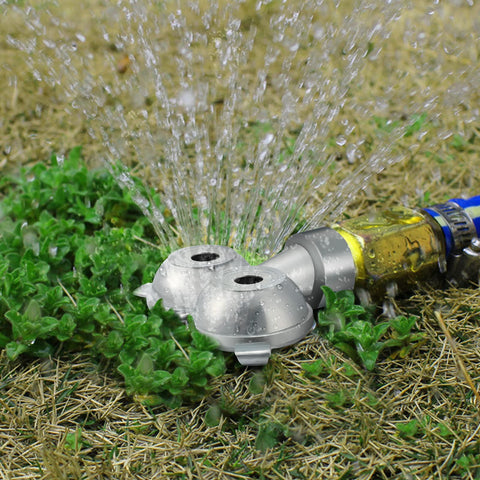 Honoson outdoor sprinkler shown cooling a sunny garden.