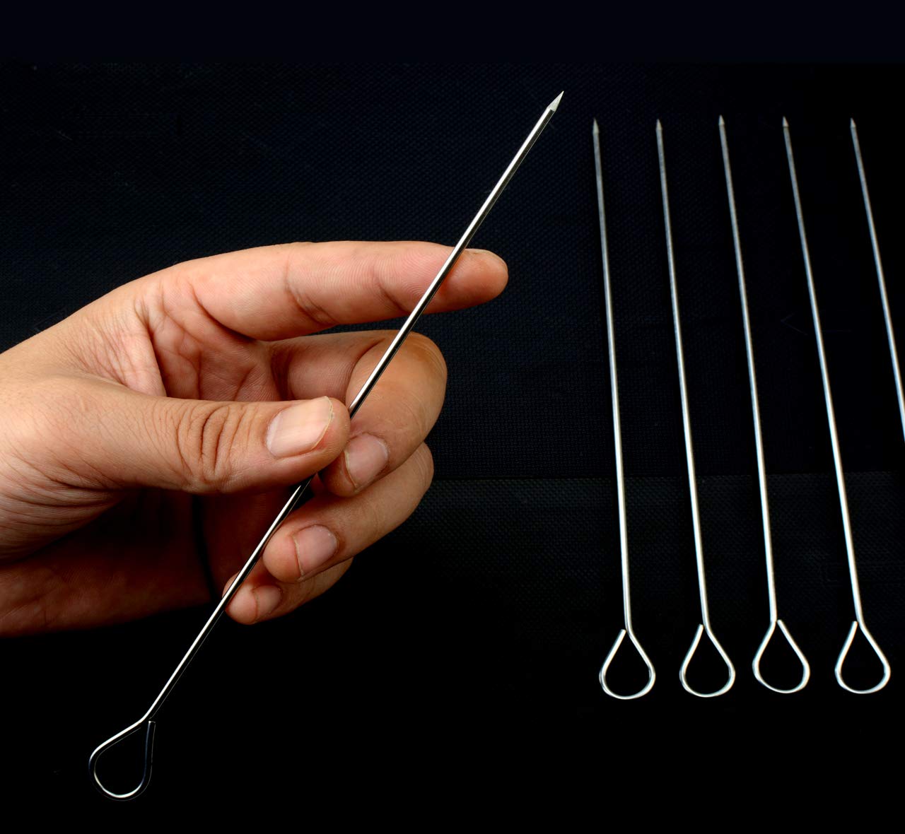 HONSHEN ring-tip handle skewers for safe, precise turning on the grill.