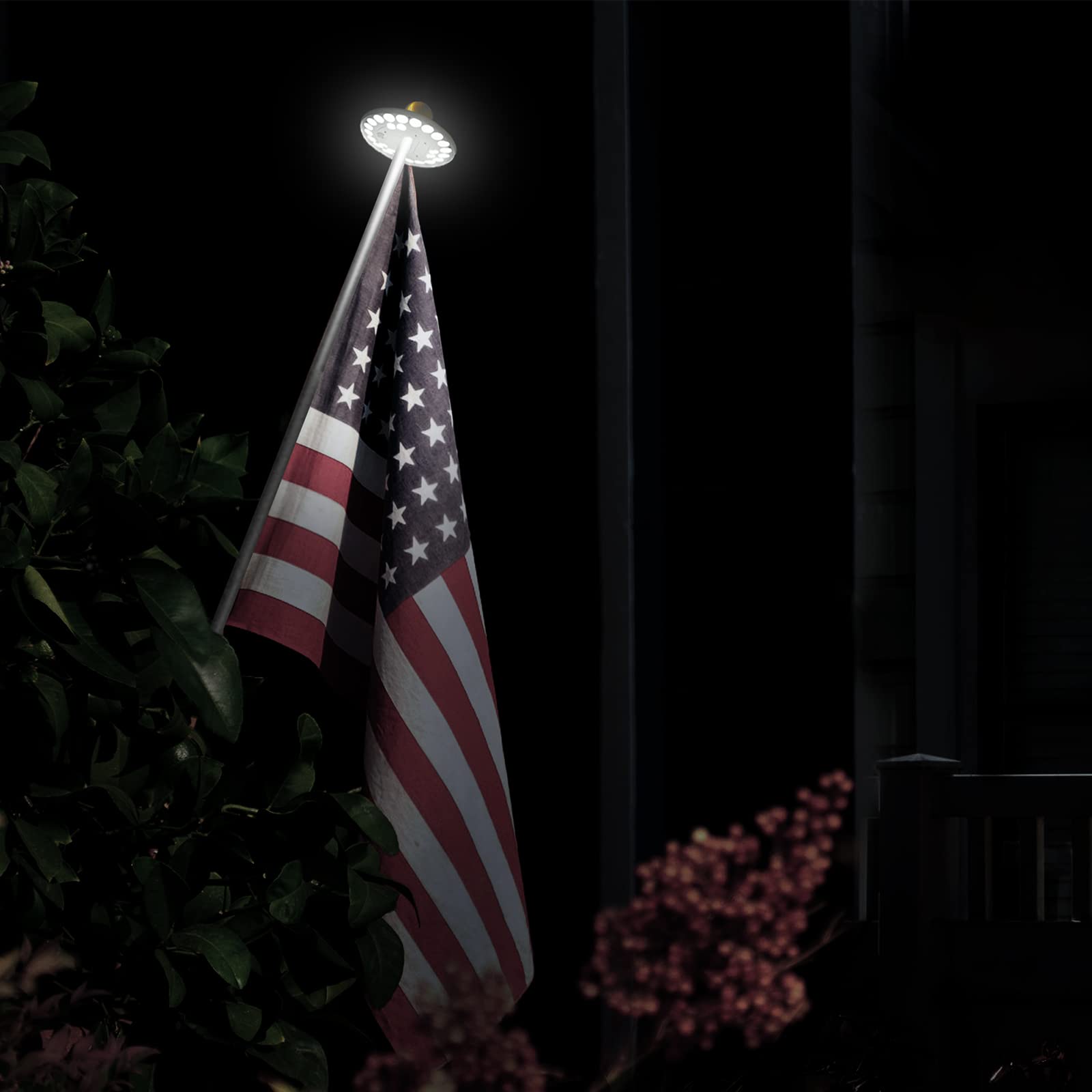 Dusk-to-dawn illumination from HOOPLE flag light enhances flag visibility.