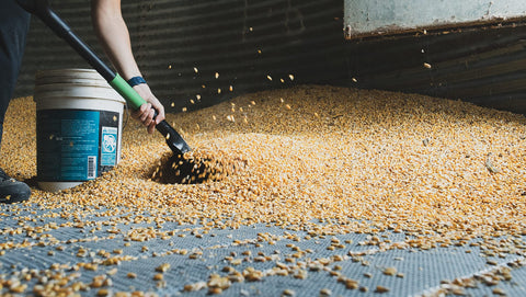 Hooyman scoop shovel in garden use demonstrates versatile material handling