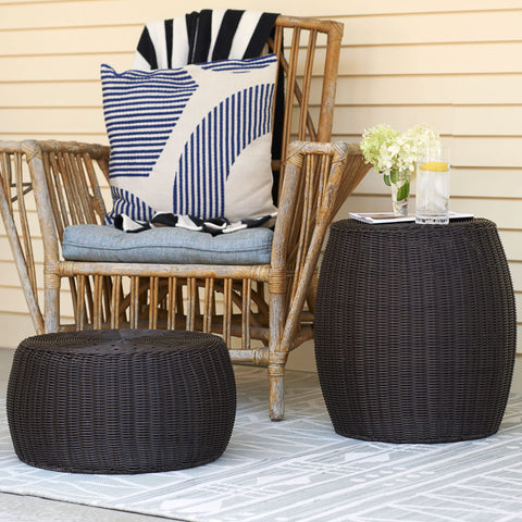 Brown resin stool complements patio and living room decor.