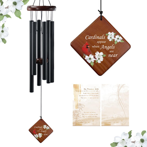 Chimes hanging from a tree branch for outdoor remembrance