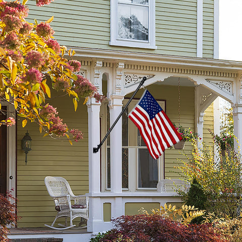 Outdoor porch display setup with HPGOED flagpole kit ready for use.