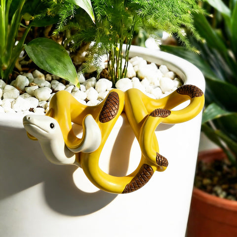 HUFAND banana snake plant pot hugger figurine adds playful charm to pots.