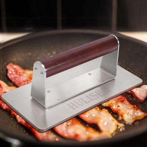 HULISEN patty press on griddle helps even sear and drain fat