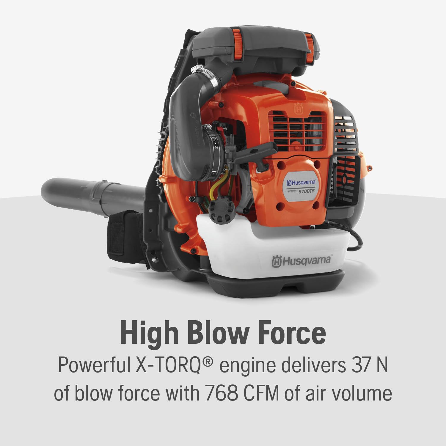 Husqvarna 570BTS engine detail highlighting X-Torq for cleaner emissions.