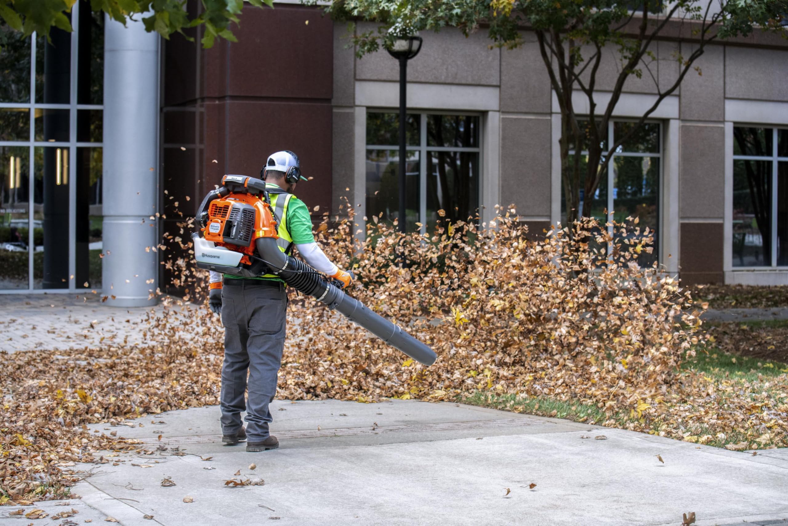 Husqvarna 580BTS in-use scene shows professional-grade power on large properties.