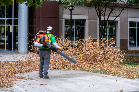 Husqvarna 580BTS in-use scene shows professional-grade power on large properties.