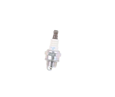 Husqvarna spark plug installation view showing easy fit.