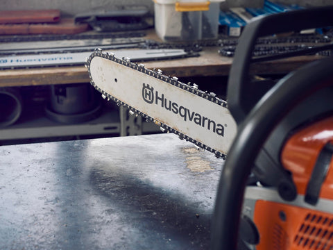 Husqvarna X-CUT C85 20-Inch chain in hand highlights sharpness and longevity.