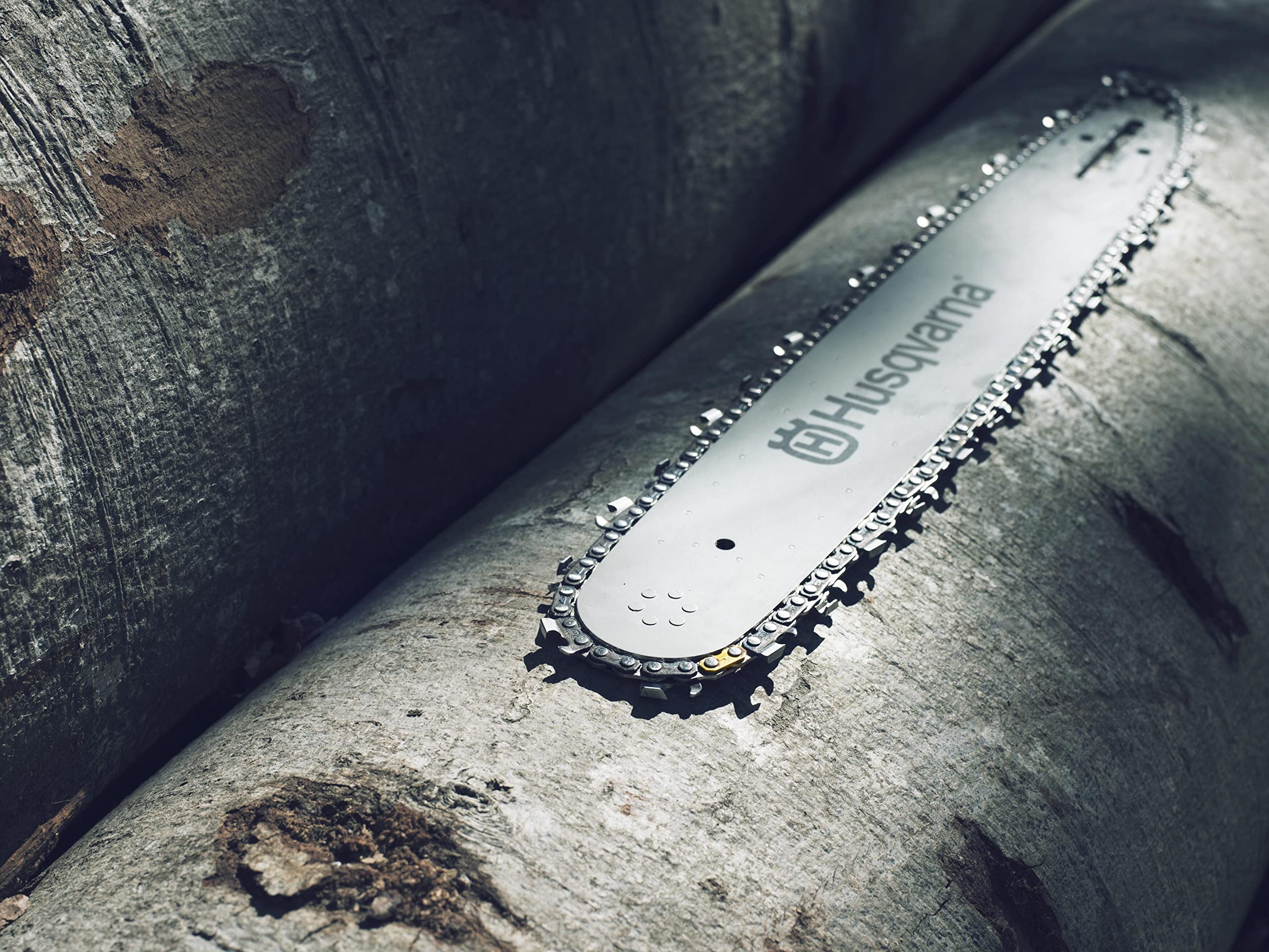 Husqvarna X-CUT C85 20-Inch chain installed on bar for smooth performance.