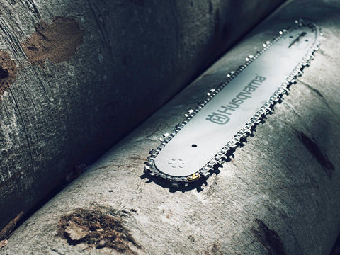 Husqvarna X-CUT C85 20-Inch chain installed on bar for smooth performance.