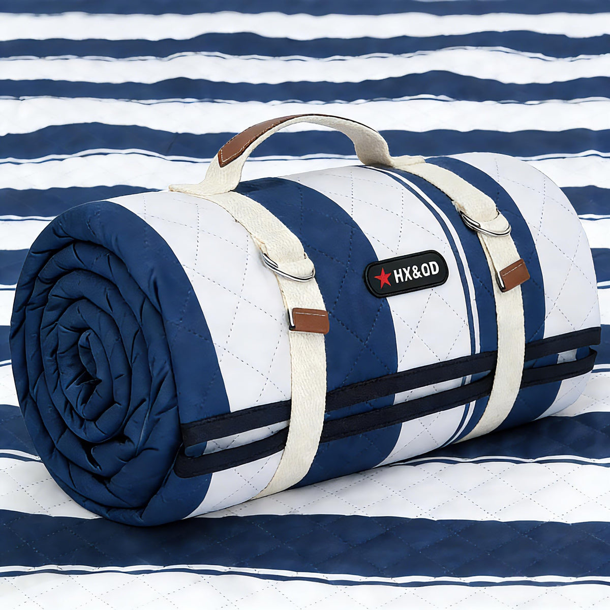 HX&OD outdoor picnic blanket 80x60 laid out for family seating on grass.