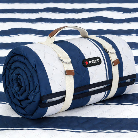 HX&OD outdoor picnic blanket 80x60 laid out for family seating on grass.