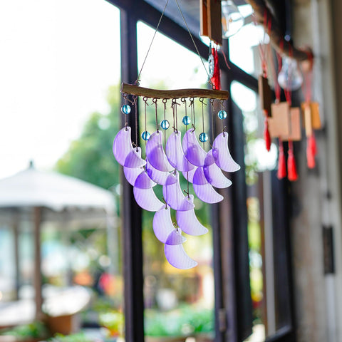 Hyaline Dora glass moon wind chime for patio decor with relaxing tones.