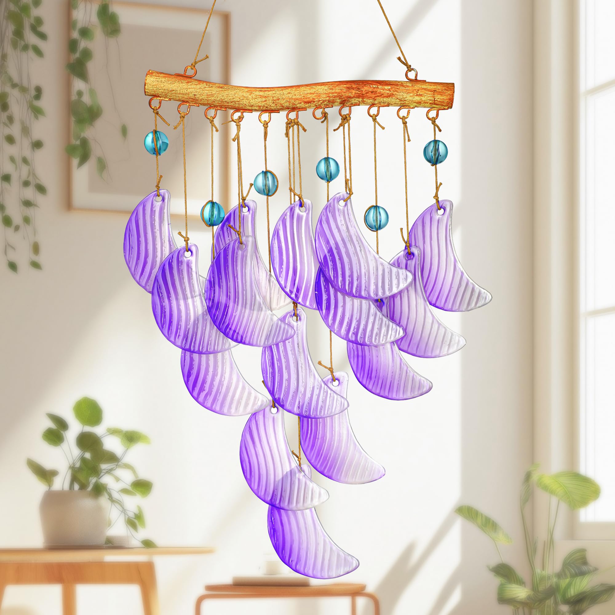 Hyaline Dora glass moon wind chime for outdoor use, creates tranquil garden ambiance.