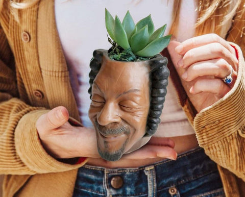 Igreli planter displayed with necklace or makeup for creative decor.