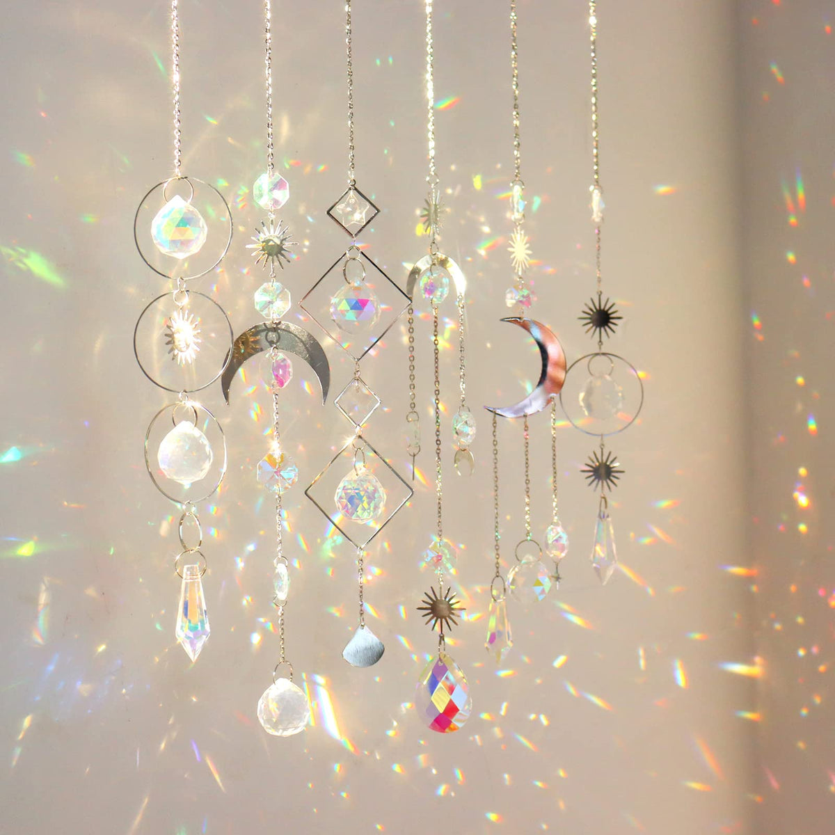 ilclviz crystal suncatchers 6pc set catching sunlight to create colorful rainbows indoors.