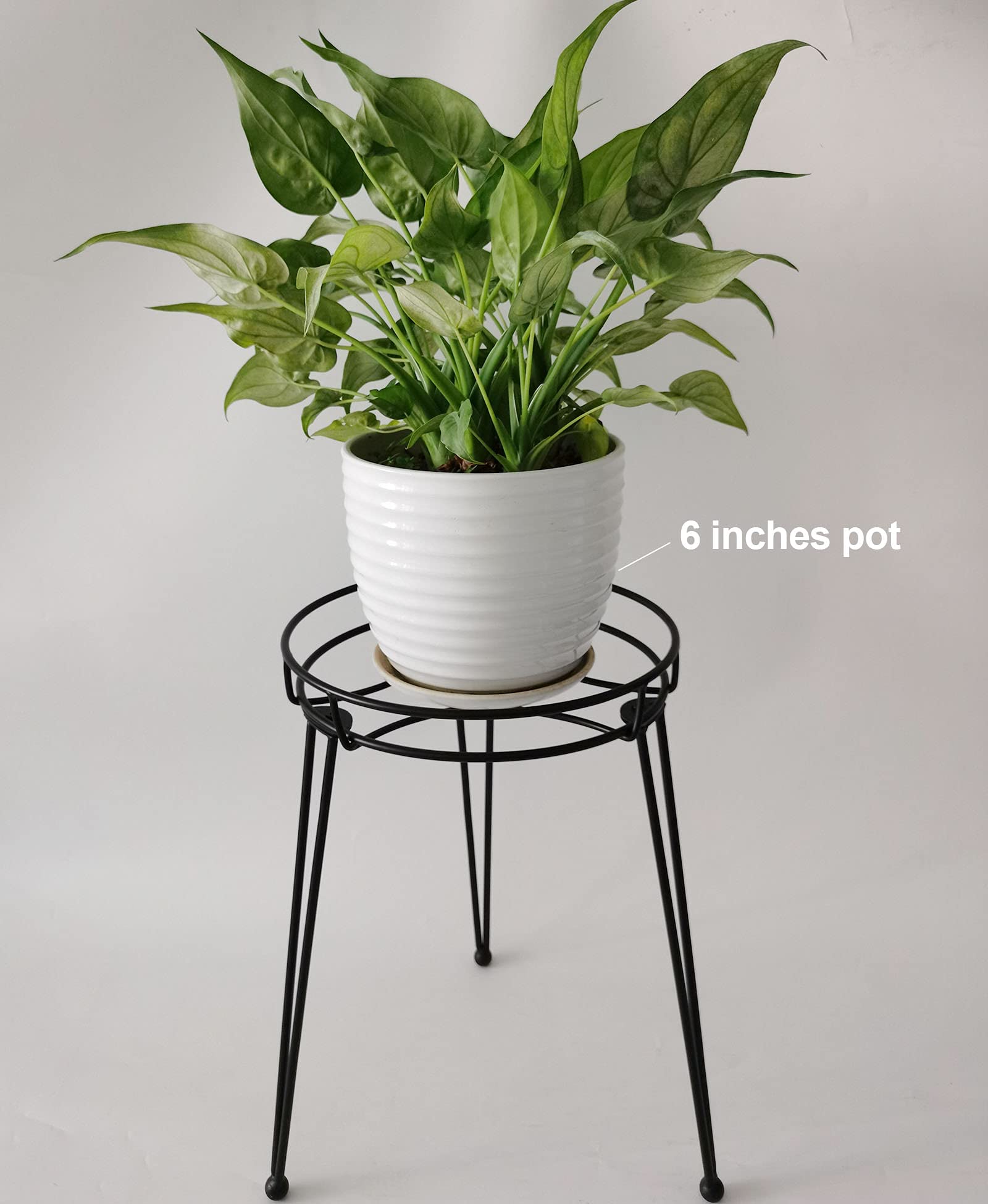 iLTreFlo midcentury stand in use demonstrates easy stacking for storage
