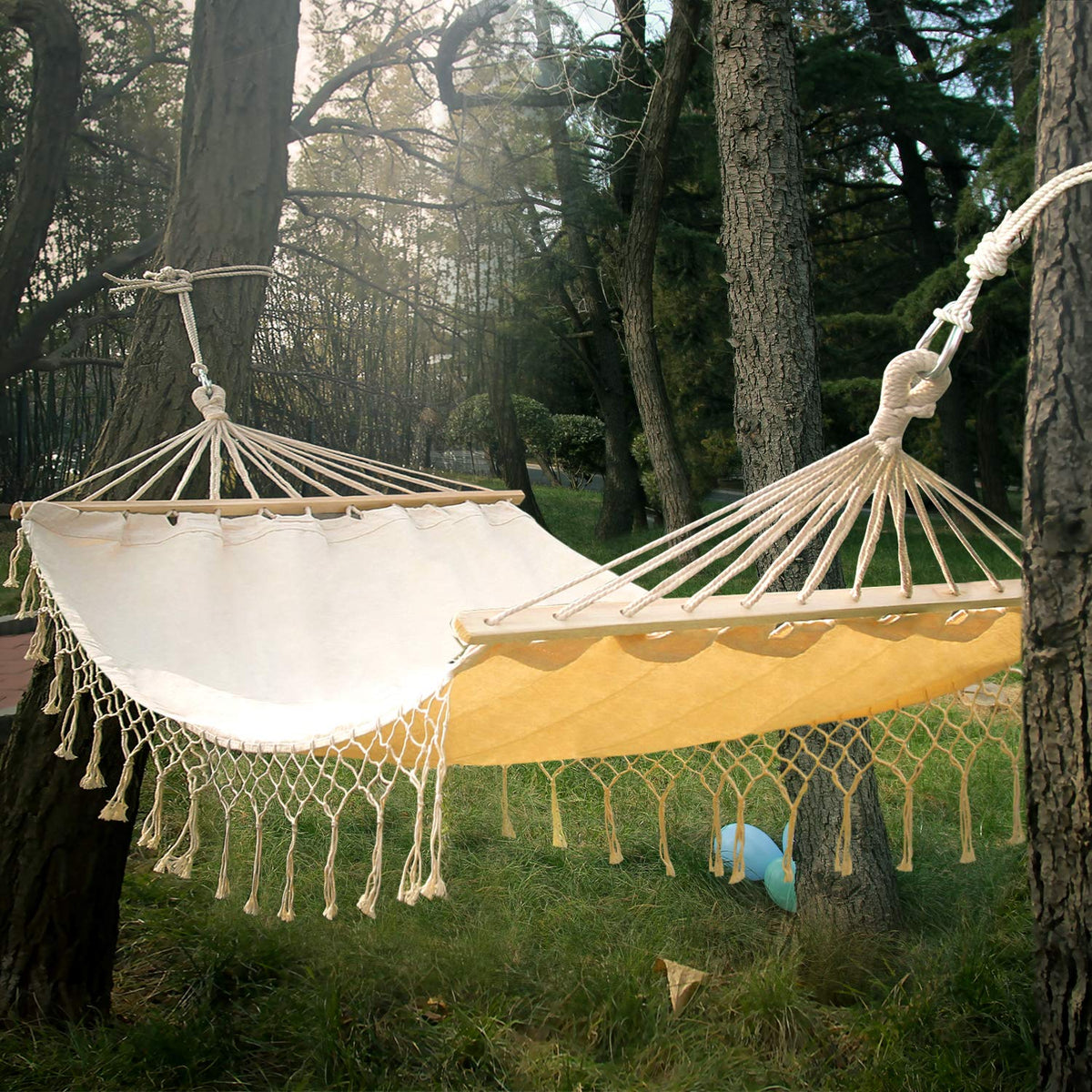 INNO STAGE double white canvas hammock basking in sun for outdoor relaxation.