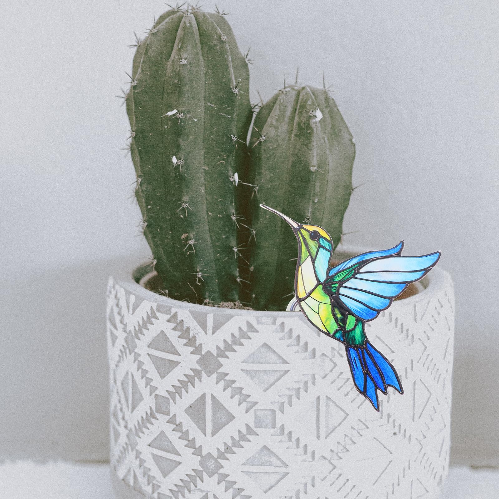 INOOMP indoor plant display bird sculpture enhances greenery with character.