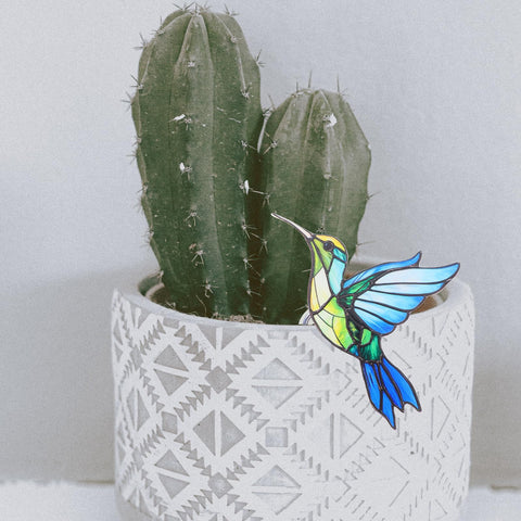 INOOMP indoor plant display bird sculpture enhances greenery with character.