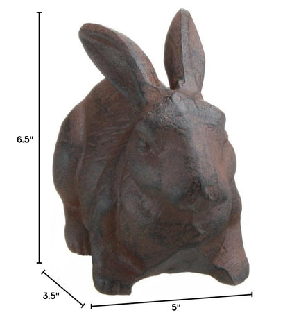 INsideOUT rabbit figure placed among potted plants, suggesting stylish outdoor or porch display.
