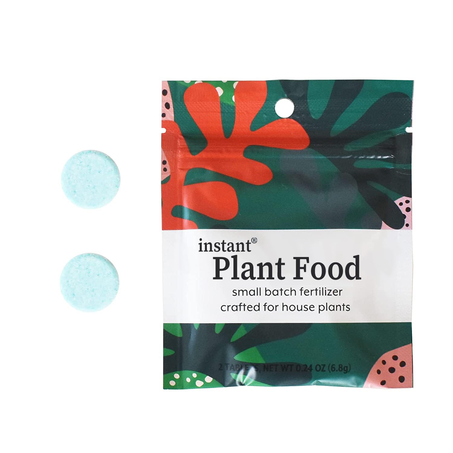 Instant Biologics self-dissolving tablet dissolving in water to feed indoor plants.
