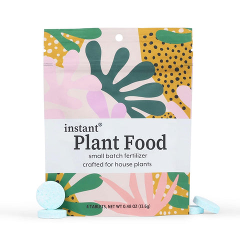 INSTANT BIOLOGICS self-dissolving tablets in glass feed indoor plants with convenience.