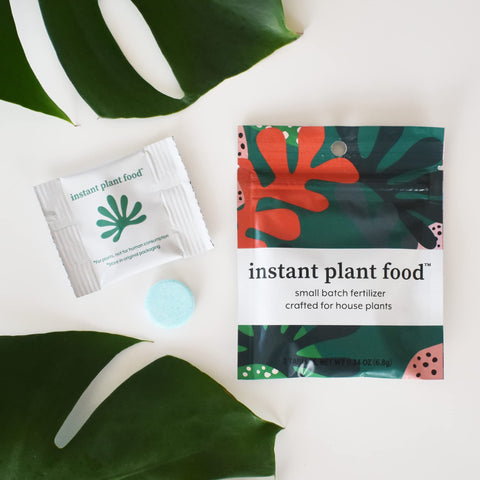 Instant Biologics tablet dissolving in glass shows easy, mess-free plant feeding.