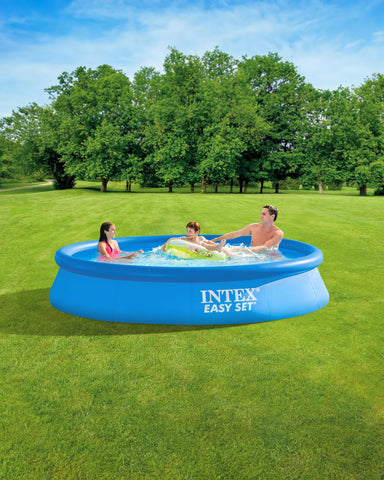 Intex Easy Set pool water fill shows a sunny backyard oasis during setup.