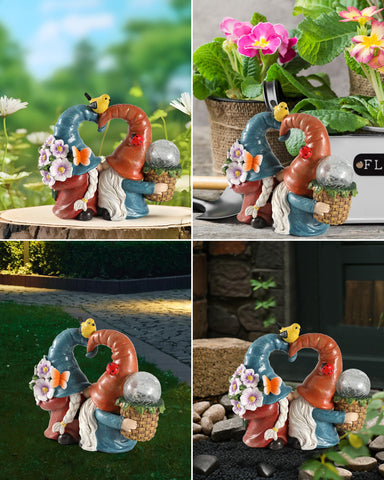 istatue kissing gnomes with LED lighting highlighting fine features at dusk