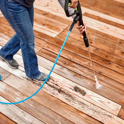 JANSAMN mower deck cleaning uses angled spray to reach underneath.