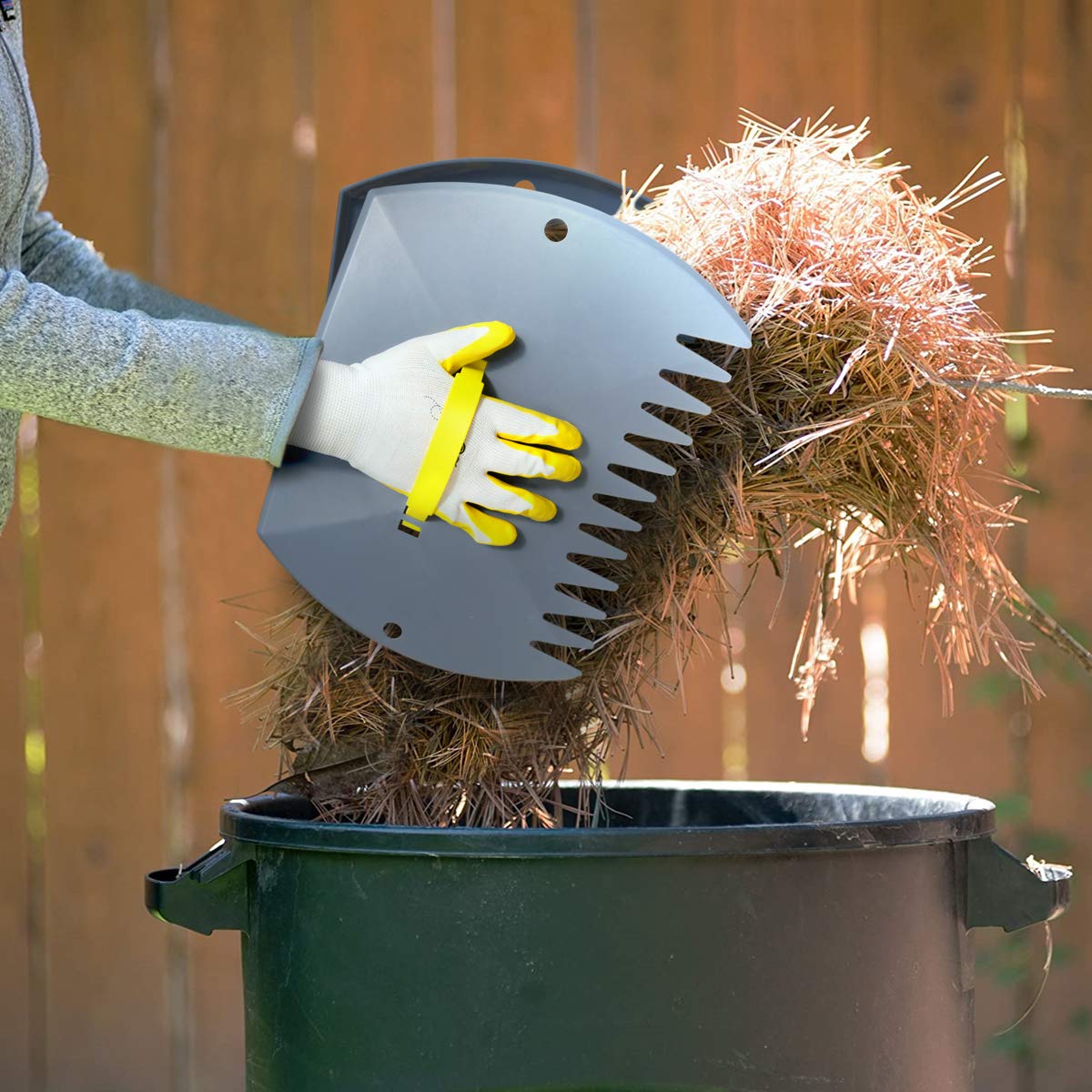 Jardineer multi-use leaf grabber claws handling leaf piles, grass clippings, and debris.