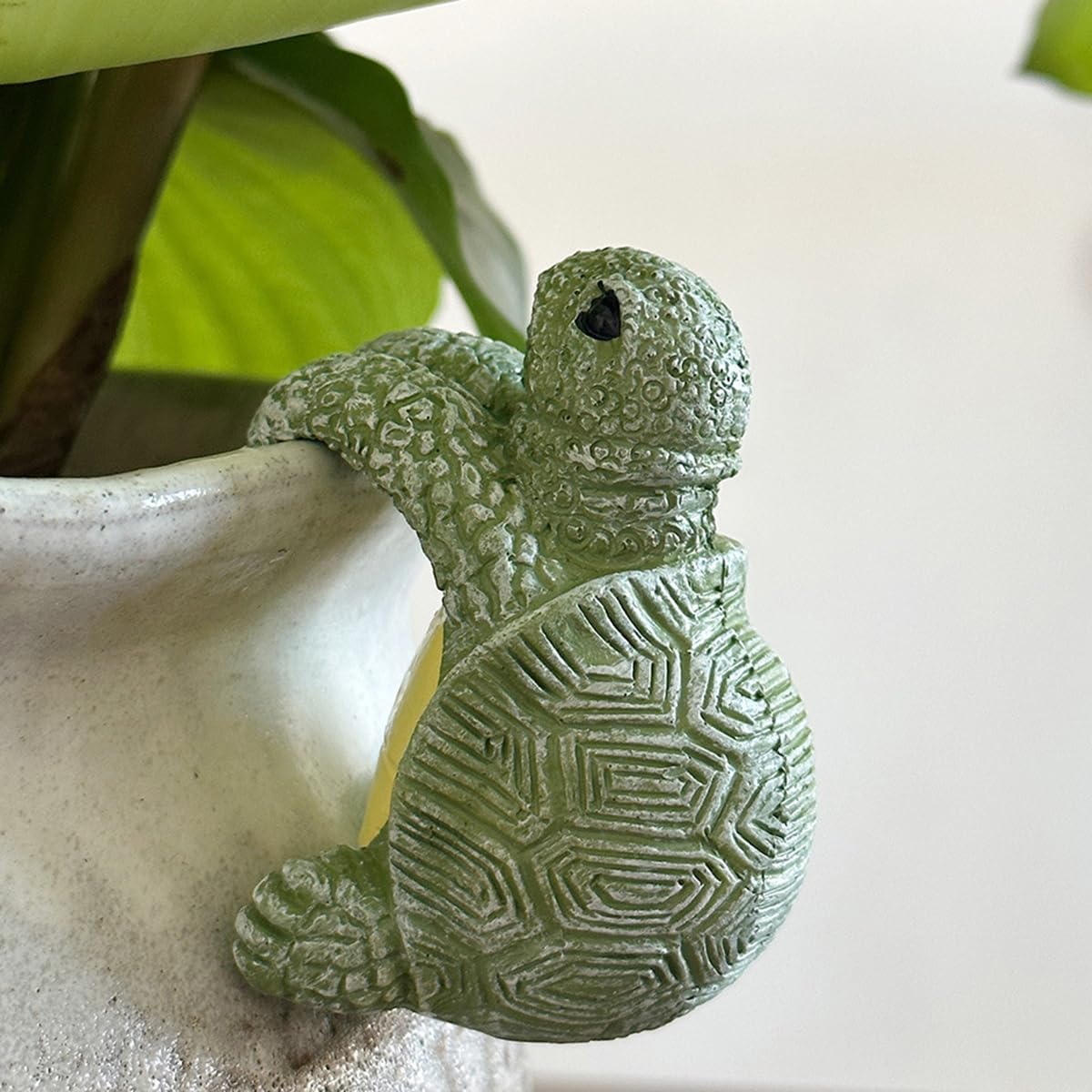 JARPSIRY cute climbing tortoise planter hugger on pot adds whimsical outdoor charm.