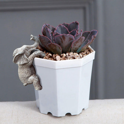 JARPSIRY elephant hugger yard ornament brings playful character.