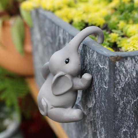 JARPSIRY indoor-outdoor hugger elephants sit on planter rims easily.