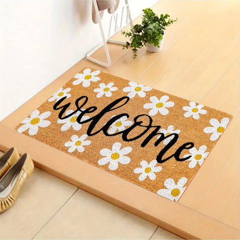 JarThenaAMCS Indoor-outdoor daisy mat with pattern reduces tracked dirt.